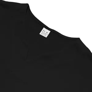 Detail shot of men's black V-neck jersey showing quick-dry fabric texture and size tag