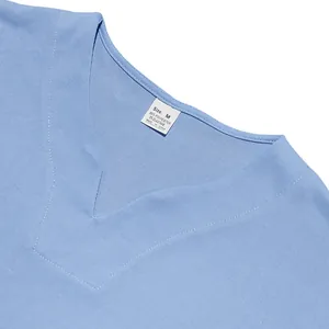 Detail of blue V-neck jersey collar showing fabric texture and material size tag