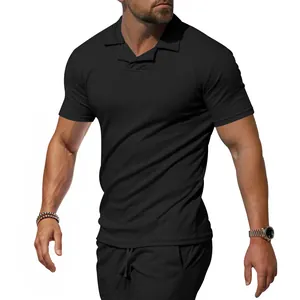 Detail of black men's short sleeve polo shirt with breathable athletic fabric and slim fit.