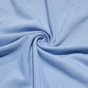Detailed macro view of light blue breathable and quick-dry polo shirt fabric texture