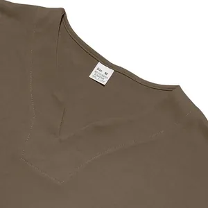 Detailed close-up of V-neck collar and size label on brown men's summer jersey shirt