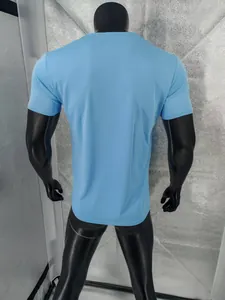 Back view of a breathable light blue men's quick-dry short-sleeved T-shirt on a mannequin