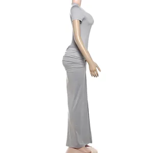 Side view detail of a grey short-sleeve bodysuit and high-slit maxi skirt two-piece set.
