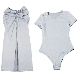 Detail view of the grey short sleeve bodysuit and twisted knot split maxi skirt set
