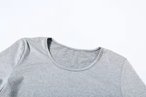 Detailed view of a soft heather gray round neckline showing fine professional stitching