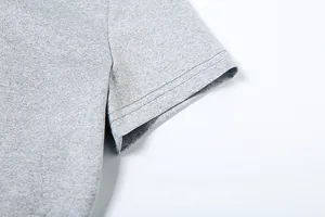 Detailed close-up of grey heather short sleeve hem with professional double-stitching.