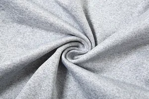 Macro view of soft light gray heathered fabric showing high-quality knitted texture and detail