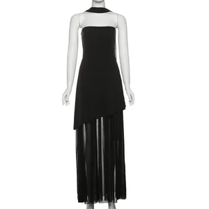 Elegant black tube top dress with asymmetrical hem and sheer mesh skirt detail