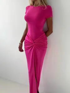 Elegant hot pink slim fit maxi dress featuring short sleeves and a stylish waist twist detail.