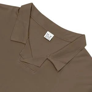Close-up of men's taupe polo shirt neckline with M size tag and fabric detail.