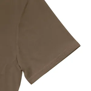 Close-up of double-stitched sleeve on brown breathable quick-dry men's Polo T-shirt.