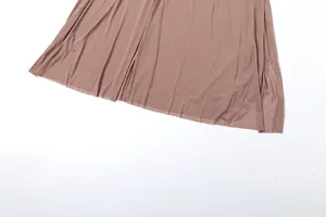Detailed macro view of sheer mesh hemline on elegant mauve tube top dress for women