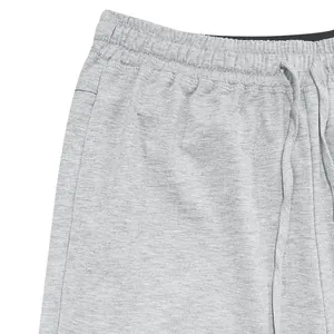 Close-up of the comfortable elastic waistband and drawstring on gray men's shorts