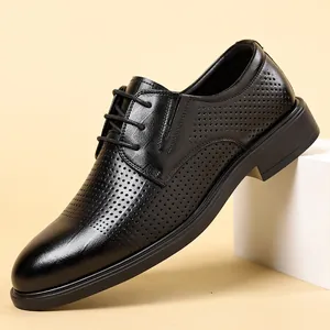 Men's stylish breathable black leather dress shoes featuring a perforated hollow design
