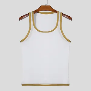 Detailed macro shot of white mesh fabric on a breathable men's fitness tank top with gold trim.
