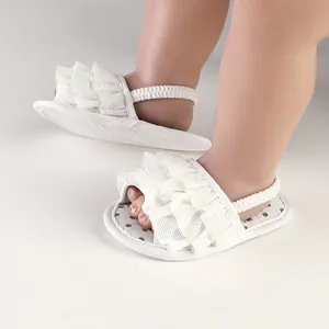 White ruffled infant walking sandals with elastic back strap for 0-1 year old babies
