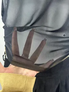Detailed close-up of breathable black mesh fabric on a men's gym sports tank top