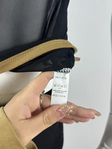 Detailed close-up view of breathable mesh fabric and 100% polyester wash care label