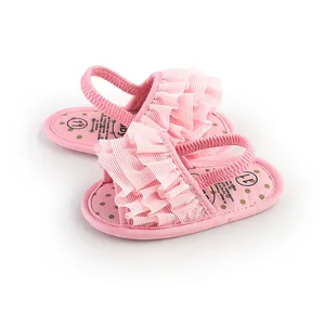 Pink ruffle baby walker shoes with elastic back strap for infant girls.