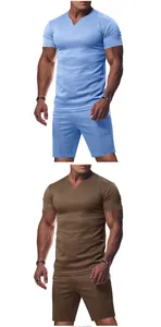Vista detallada de conjuntos de jersey con cuello en V para hombre en azul y marrón