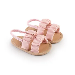 Soft pink ruched baby walking shoes with elastic heel strap for newborn girls