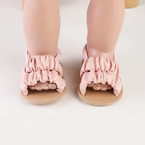 Detailed view of soft pink ruffled leather summer sandals for 0-1 year old baby girls