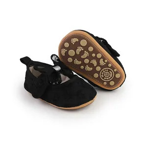 Detailed view of black lace baby prewalker shoes with bow and soft non-slip sole