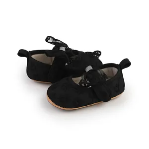 Elegant black baby girl walking shoes with delicate lace bows and floral embroidery