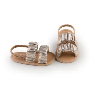 Metallic champagne gold ruched cloud baby sandals with soft soles and elastic heel strap