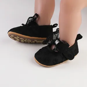 Detailed view of black lace baby girls walking shoes with soft princess style soles