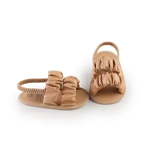 Comfortable soft sole cloud baby sandals with beige ruffled straps and elastic heel strap