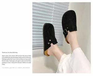 Close-up of sparkling black rhinestone platform clogs with buckle strap