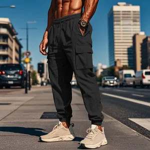 Street style view of men's black multi-pocket cargo jogger pants with drawstring waist
