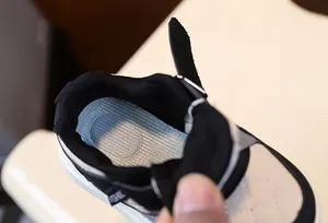 Close-up macro view of the comfortable blue cushioned insole in children's sneakers