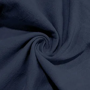 Macro view showing the breathable navy blue linen fabric texture for men's beach pants