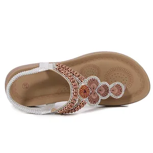 Bohemian flat sandals for women featuring rhinestone accents and decorative beads