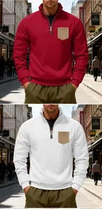 Close-up of men's half-zip fleece sweatshirts in red and white with a contrast chest pocket