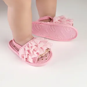 Detailed view of pink ruffled baby prewalker sandals featuring a soft elastic back strap