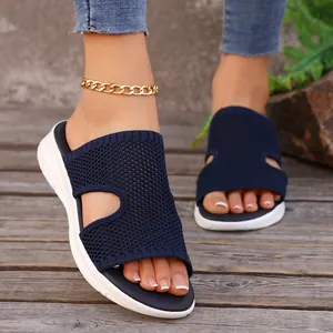 Sandales compensées femme en maille bleu marine avec tige en tricot et semelle épaisse