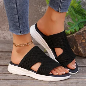 Mules noires respirantes en maille avec semelles compensées et ajourées pour femmes