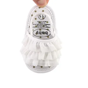 White ruffled baby sandals for newborn girls with breathable design and soft sole