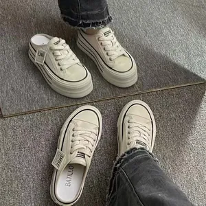 Close-up of stylish platform mule sneakers for women with breathable mesh and thick soles