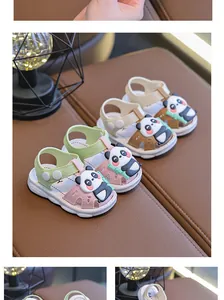 Close-up of children's summer sandals with cute cartoon panda design and soft non-slip soles