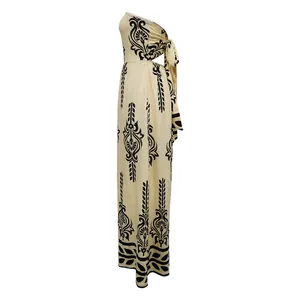 Side view detail of an elegant tube-top maxi jumpsuit with black damask floral print pattern