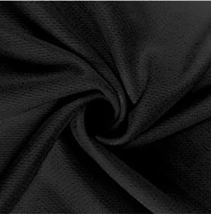 Gros plan sur la texture du tissu noir à séchage rapide respirant pour le sport
