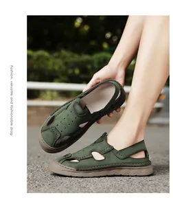 Detail of men's green closed-toe breathable beach sandals with hand-stitched sole