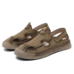 Close-up detail of men's brown breathable closed-toe leather outdoor beach sandals