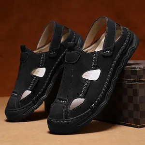 Close-up detail of black breathable men's closed-toe sandals with leather texture