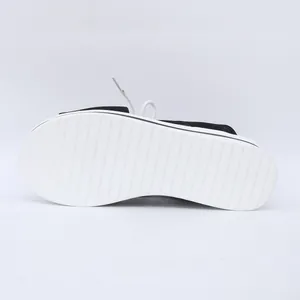 Detail view of the white ribbed non-slip outsole of women's platform beach sandals
