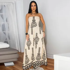 Elegant strapless wide-leg jumpsuit with black ethnic pattern print on beige fabric